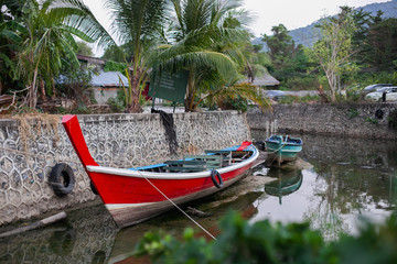 old traditional boat on the lake in thailand village