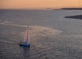 Big sailing ship stands at sunset