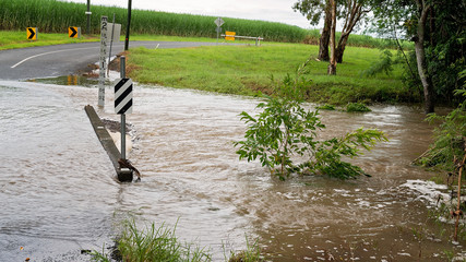 Heavy Tropical Rainfall Causes Flooding Over Creek Road