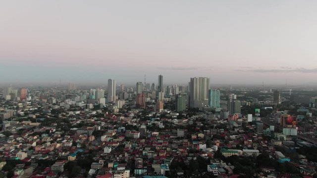 Aerial Drone shot of Cubao in Quezon City, Manila, Philippines while sunrise