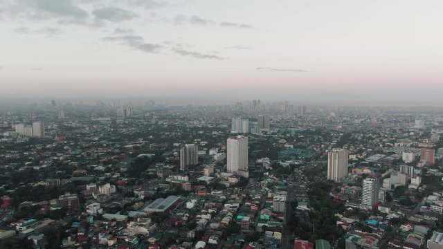 Aerial drone flying slowly over quezon city in Manila