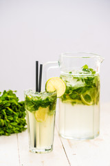 mojito in a decanter. refreshing drink with lime mint.