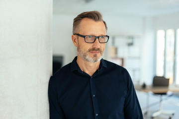 Handsome middle-aged man looking away