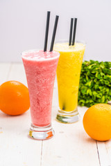 smoothie orange and strawberry. drinks in a glass. healthy diet
