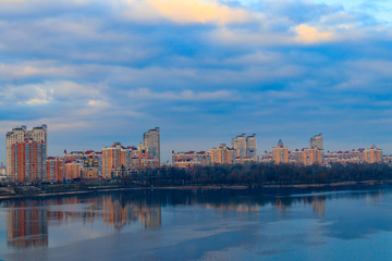 Fototapeta premium View of Obolon embankment of the Dnieper river and church of the Nativity of Christ in Kiev, Ukraine