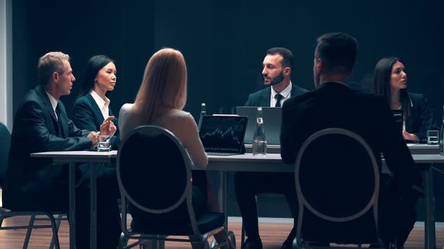 The business team discussing cases at the conference
