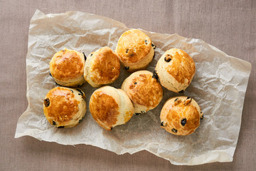 English sсones with raisins on a brown background
