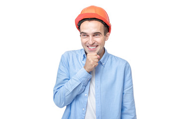 Joyful builder in helmet giggles, isolated background, copy space