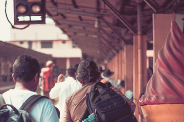 People locals and tourists go on 1 track of the railway station platform in Galle Sri Lanka