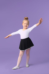 Cute little ballerina on color background