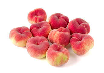 Fresh flat peach isolated on white background.