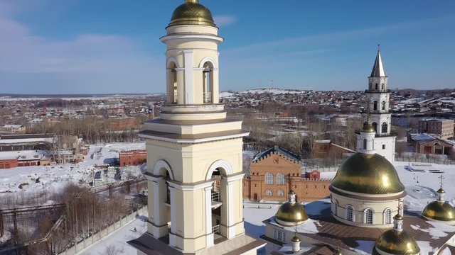 Flying over the Nevyansky Leaning Tower and the Transfiguration Cathedral. View from above. City Nevyansk. Russia