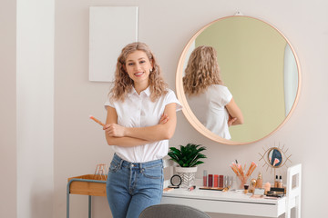 Professional female makeup artist in beauty salon