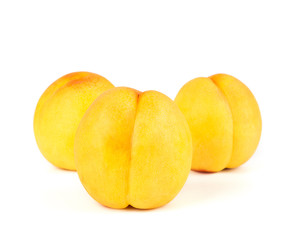 Fresh yellow peach isolated on white background.