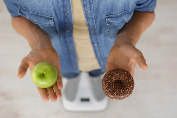 choosing between donut and apple