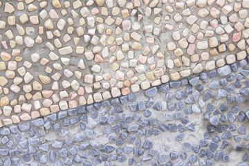 Decorative small stone texture on concrete wall brown and dark blue background