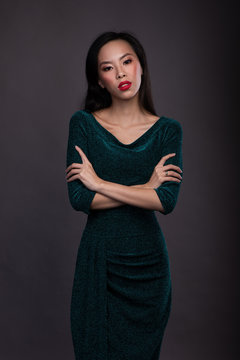 Portrait of asian woman with red lips in dress