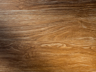 Empty wooden table background texture with light and shadow on surface.