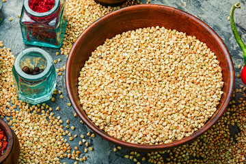 Green buckwheat on wooden table