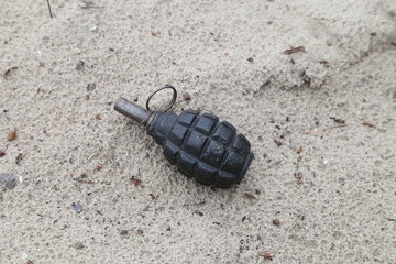 old grenade f-1 in the sand