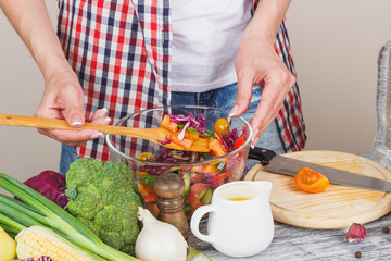 Woman cooks at the kitchen, body part