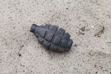 old grenade f-1 in the sand