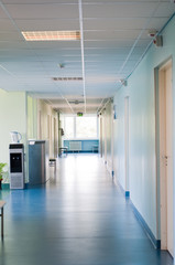 Long corridor in hospital with doors and reflections