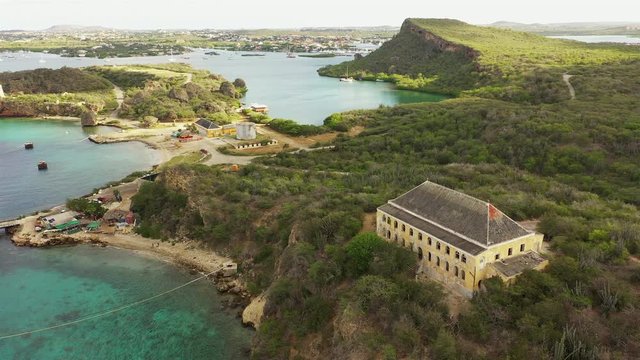 Aerial view around Director's bay - Curaçao - Caribbean Sea with former Quarantine house,  turquoise water, cliff, beach and beautiful coral reef
