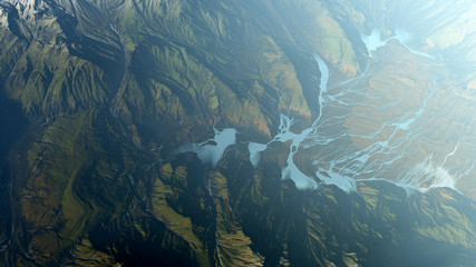 Aerial of foggy remote mountain landscape. Computer generated image.