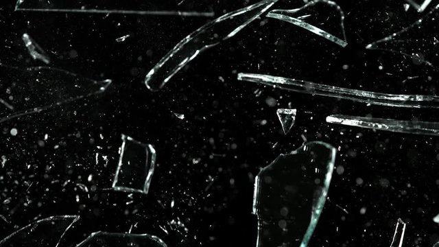 Super Slow Motion Shot of Real Glass Break at 1000 fps Isolated on Black Background.