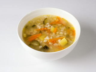 Russian soup Rassolnik in a white deep plate. Side view