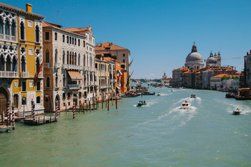 VENICE, ITALY -APRIL 8: Gondolas and tourists on April 8, 2011 in Venice, Italy. Venice has an average of 50,000 tourists a day and was the 26th most visited city in the world.