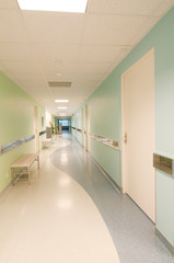 Long corridor in hospital with doors and reflections
