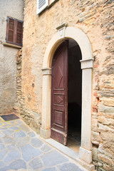 Little lane French village Casinca open church door