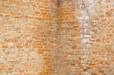 Corner of an old brick wall as a background.