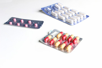 pharmaceuticals antibiotics pills medicine /colorful antibacterials pills on white background