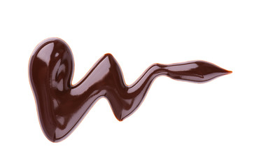 Chocolate syrup drizzle isolated on white background. Splashes of sweet chocolate sauce. Top view.