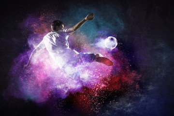 Fototapeta na wymiar Boy playing soccer hitting the ball