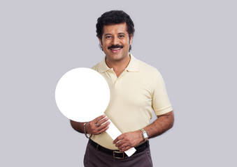 Man in a happy mood holding a magnifying glass made of cardboard. 