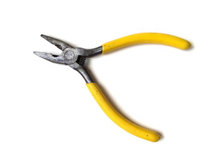 Fototapeta premium Close up of electrical pliers isolated on white background. Yellow handle pliers. Hand tool.