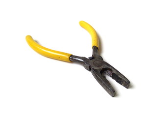 Close up of electrical pliers isolated on white background. Yellow handle pliers. Hand tool.