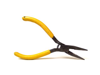 Close up of electrical pliers isolated on white background. Yellow handle pliers. Hand tool.