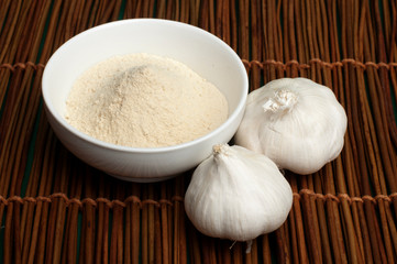 Crushed garlic powder and whole garlic