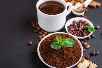 Mushroom Chaga Coffee Superfood Trend-dry and fresh mushrooms and coffee beans on dark background with mint.