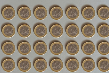One euro coins layout on white background top down view. Finance and money concept. 