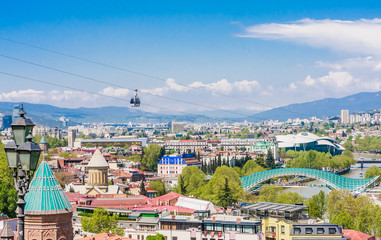 View of Tbilisi city from Narikala Fortressl, old town and modern architecture.  Bridge of Peace Presidential, Justice House  and Saint George's Church.  Georgia