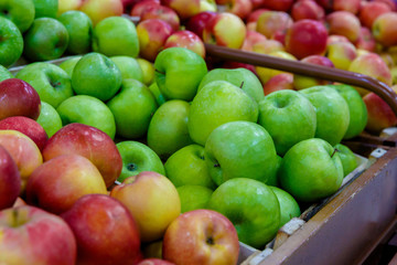 in the store a counter or a showcase with fruit apples