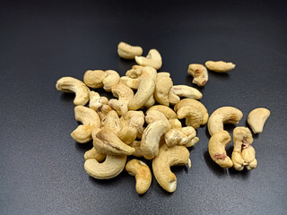 rosted cashew on black textures background