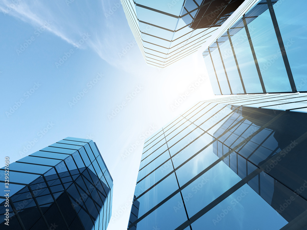 Poster view of high rise glass office building and dark steel window system on blue clear sky background,bu