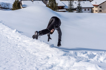 boy accidentally falling on the snow 